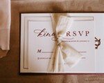 invitation card with the inscription tied with ribbon