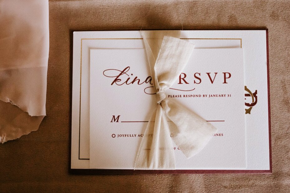 invitation card with the inscription tied with ribbon