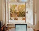 macbook pro on brown wooden table